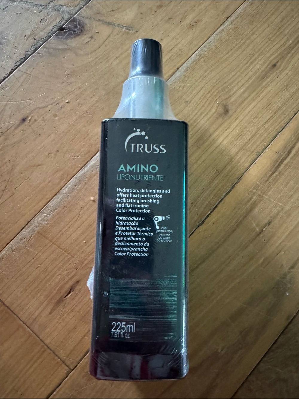 Truss Amino Liponutriente Hair Treatment — Black Bottle with Teal Accents